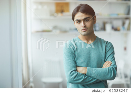 Young man standing at office 62528247