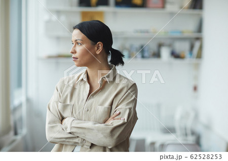 Pensive young woman Pensive young woman 62528253