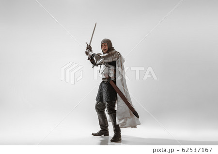 Brave armored knight fighting isolated on white studio background 62537167