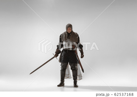 Brave armored knight fighting isolated on white studio background Brave armored knight fighting isolated on white studio background 62537168