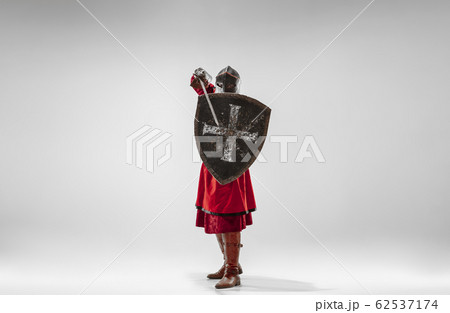 Brave armored knight fighting isolated on white studio background Brave armored knight fighting isolated on white studio background 62537174