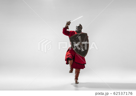 Brave armored knight fighting isolated on white studio background Brave armored knight fighting isolated on white studio background 62537176