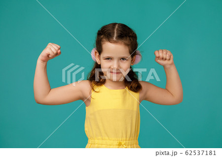 angry little child girl in dress raising fist angry little child girl in dress raising fist 62537181