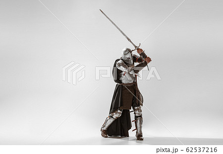 Brave armored knight fighting isolated on white studio background Brave armored knight fighting isolated on white studio background 62537216
