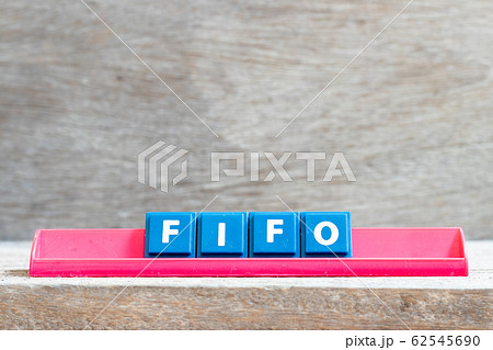 Tile letter on red rack in word FIFO Tile letter on red rack in word FIFO 62545690