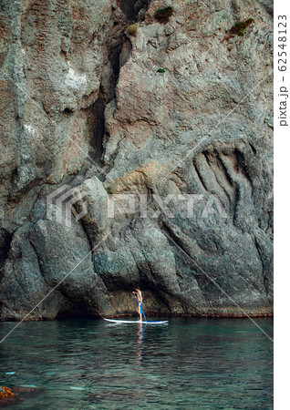 Stand Up Paddling in the sea. SUP. Guy Training in Stand Up Paddling in the sea. SUP. Guy Training in 62548123