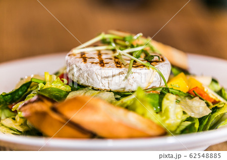 Fresh and healthy vegetable salad with cheese Fresh and healthy vegetable salad with cheese 62548885