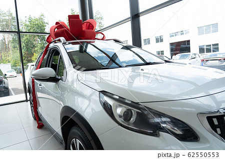 Luxury Present. Electric car with bow at salon Luxury Present. Electric car with bow at salon 62550553