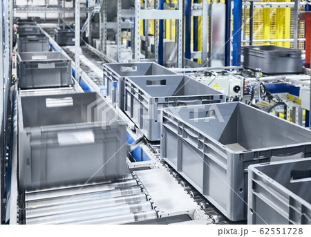 Conveyor system with boxes in motion. 62551728