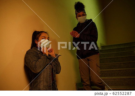 a young Asian and African girl in disposable a young Asian and African girl in disposable 62552287