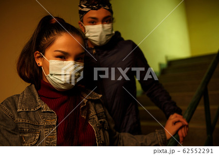 young Asian and African girl in disposable medical young Asian and African girl in disposable medical 62552291