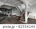 An old staircase inside an abandoned industrial 62554144