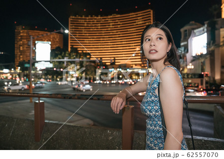 asian woman traveler standing leaning on railing asian woman traveler standing leaning on railing 62557070