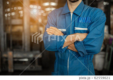 Close up image Engineer men wearing uniform safety in factory background. 62559021