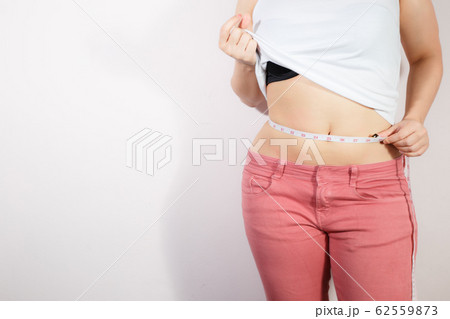 Woman diet lifestyle concept to reduce belly. 62559873