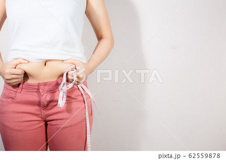 Woman diet lifestyle concept to reduce belly. 62559878