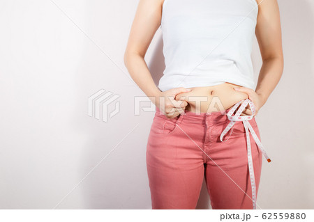 Woman diet lifestyle concept to reduce belly. 62559880