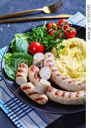Simple meal potato aligot with sausage on a plate 62561582