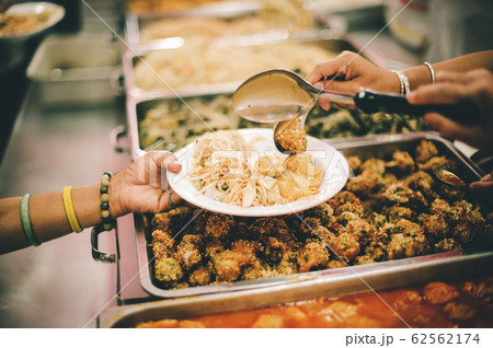 Food donation to the poor and concept of sharing Food donation to the poor and concept of sharing 62562174