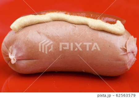 sausage with ketchup and mustard close up 62563579