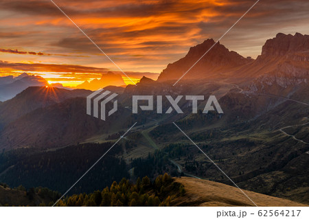 Misty sunrise at Pass Pordoi. Dolomites mountains, Italy 62564217