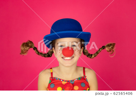 Funny girl clown playing indoor 62565406