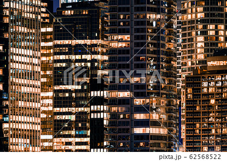 Facade windows of illuminated modern skyscraper 62568522
