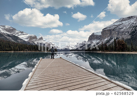 Man traveler standing on pier in Spirit Island on 62568529