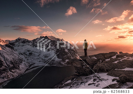 Man traveler standing on top of Ryten mount in 62568633