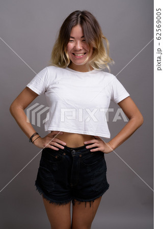 Young beautiful Kazakh woman against gray background 62569005