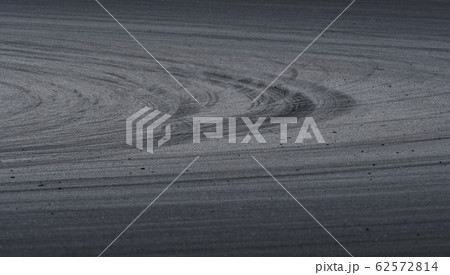 Asphalt race track detail with tire mark Asphalt race track detail with tire mark 62572814