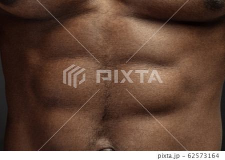 Texture of human skin. Close up of african-american male body Texture of human skin. Close up of african-american male body 62573164