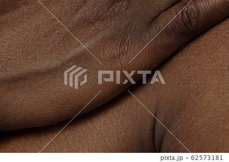 Texture of human skin. Close up of african-american male body 62573181