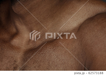 Texture of human skin. Close up of african-american male body Texture of human skin. Close up of african-american male body 62573188
