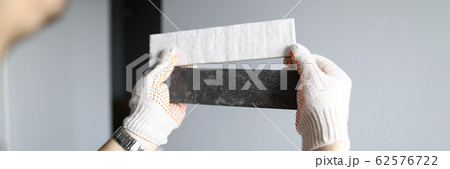 Repairman choosing right color of materials for interior details 62576722