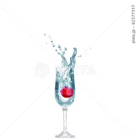 Strawberry splash in a cocktail glass on white 62577357