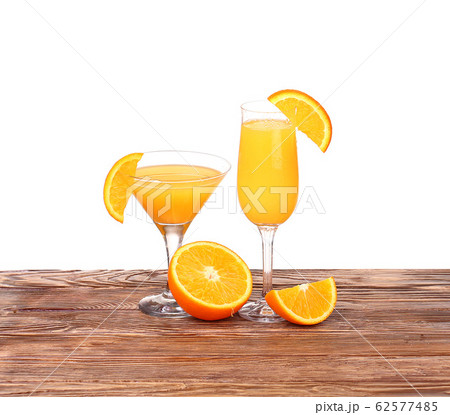 Glass of freshly pressed orange juice with sliced Glass of freshly pressed orange juice with sliced 62577485