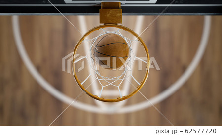3d render Basketball ball flies into the basket top view 3d render Basketball ball flies into the basket top view 62577720