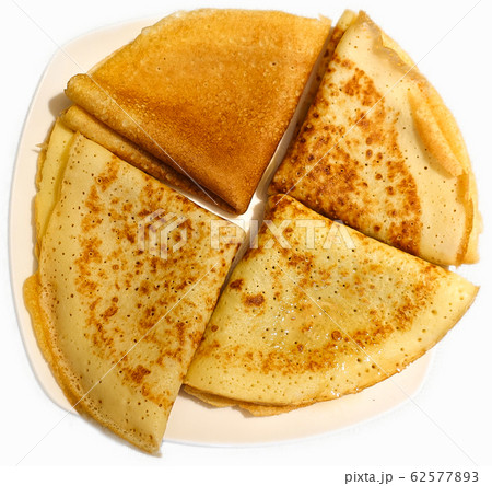 Traditional Russian pancakes on a plate. Handmade. 62577893