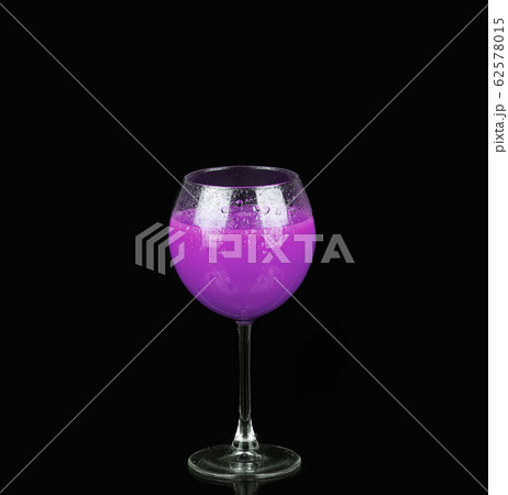 Purple alcoholic cocktail in a glass on black Purple alcoholic cocktail in a glass on black 62578015