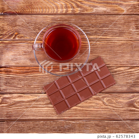 A cup of tea or coffee. Dark Chocolate. Wooden 62578343