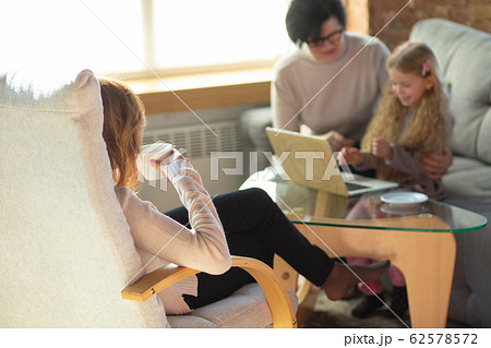 Happy loving family. Grandmother, mother and daughter spending time together 62578572