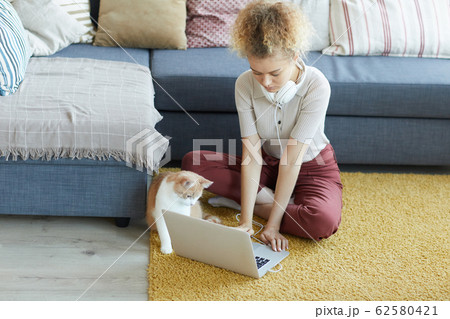 Woman typing on laptop Woman typing on laptop 62580421