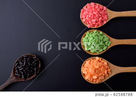 Colorful candies on black background 62588788