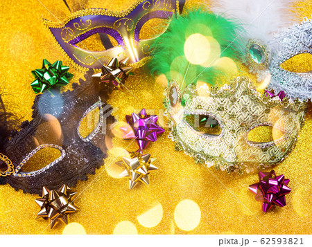 Colorful mardi gras carnival masks on golden 62593821