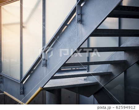 Metal Stairs step Staircase cement wall Industrial building  62594912