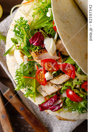 Tortilla chicken with french fries Tortilla chicken with french fries 62597342