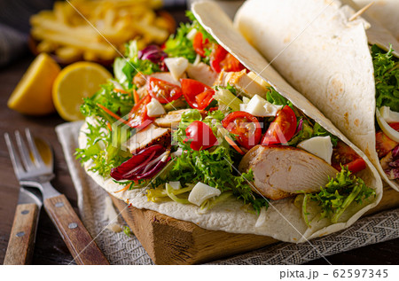 Tortilla chicken with french fries Tortilla chicken with french fries 62597345