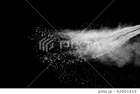 Freeze motion of white dust particles splash on black background.White powder explosion clouds. Freeze motion of white dust particles splash on black background.White powder explosion clouds. 62601819