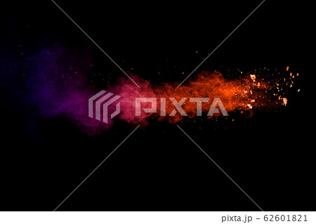 Orange blue powder explosion on black background.Orange blue color dust splash clouds. Orange blue powder explosion on black background.Orange blue color dust splash clouds. 62601821